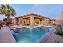 Inviting backyard oasis with a sparkling pool, patio, and comfortable lounge furniture at 9847 E Preserve Way, Scottsdale, AZ 85262