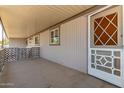 Relaxing covered porch with white screen door, and plenty of room for outdoor seating at 2650 W Union Hills Dr # 29, Phoenix, AZ 85027