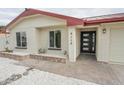 Inviting home entrance featuring a modern front door and recently updated windows and exterior lights at 4115 W Sierra St, Phoenix, AZ 85029