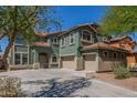 Charming two-story house with a two-car garage, well-maintained landscaping, and an extended driveway at 45080 W Buckhorn Trl, Maricopa, AZ 85139