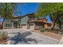 Charming two-story house with a three-car garage and well-maintained landscaping at 45080 W Buckhorn Trl, Maricopa, AZ 85139