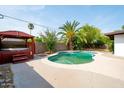 Inviting backyard pool and spa area, featuring a quaint gazebo and lush greenery for a relaxing oasis at 501 E Alameda Dr, Tempe, AZ 85282