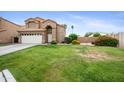 Lovely two-story home boasting a manicured lawn and a spacious driveway at 665 S Balboa --, Mesa, AZ 85206