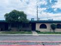 Residential home with a well-kept front yard, secure windows, and charming stone accents at 6729 N 16Th St # 21, Phoenix, AZ 85016