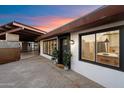 Inviting home exterior with well-maintained landscaping, a brick walkway, and updated windows at 7026 E Pasadena Ave, Paradise Valley, AZ 85253