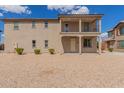 Charming two-story home with a balcony and low-maintenance landscaping at 820 E Agua Fria Ln, Avondale, AZ 85323