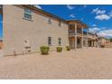 Charming two-story home with a balcony and low-maintenance landscaping at 820 E Agua Fria Ln, Avondale, AZ 85323