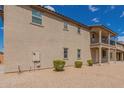Charming two-story home with a balcony and low-maintenance landscaping at 820 E Agua Fria Ln, Avondale, AZ 85323
