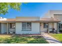 Inviting single-story home with well-maintained lawn, covered entry, and a peaceful residential setting at 8309 E Rose Ln, Scottsdale, AZ 85250