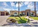 Charming home with well-maintained front yard, beautiful landscaping, and a brick driveway at 8325 W Cantera Ave, Peoria, AZ 85383
