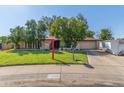 Charming single story home featuring mature trees, a lawn, and a convenient attached two car garage at 8540 N 43Rd Dr, Glendale, AZ 85302