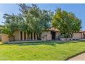 Charming single story home featuring mature trees, a lawn, and a convenient attached two car garage at 8540 N 43Rd Dr, Glendale, AZ 85302