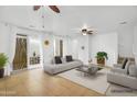 Bright living room with neutral tones, stylish furniture, and access to outdoor patio at 1069 S Nancy Ln, Gilbert, AZ 85296