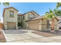 Charming two-story home featuring desert landscaping, and an attached two-car garage at 11580 N 145Th Ave, Surprise, AZ 85379