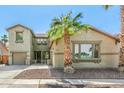 Charming two-story home featuring desert landscaping, and an attached two-car garage at 11580 N 145Th Ave, Surprise, AZ 85379