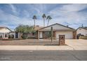 Charming brick home with mature landscaping and ample parking, complemented by palm trees at 15841 N 23Rd Pl, Phoenix, AZ 85022