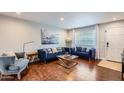 Stylish living room featuring hardwood floors, modern furniture, and bright, neutral decor at 15841 N 23Rd Pl, Phoenix, AZ 85022