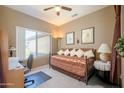 Cozy bedroom featuring a daybed, a ceiling fan, and large window offering nice natural light at 16527 W Blackhawk Ct, Surprise, AZ 85374