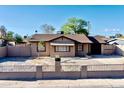Charming single-story home featuring a well-maintained yard and classic architectural details at 1914 W Colter St, Phoenix, AZ 85015