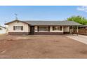 Traditional single-story home showcasing a covered parking spot and a well-maintained front exterior at 2022 E Mulberry Dr, Phoenix, AZ 85016