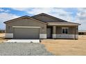 Charming single-story home with stucco, attached garage, and desert landscaping, ready for move-in at 20427 W Mountain Sage Dr, Buckeye, AZ 85326