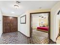 Spacious entryway featuring double doors, decorative tile flooring, and an open view to the bedroom at 2331 E Melrose St, Gilbert, AZ 85297