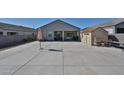 Nice backyard features a concrete patio, shed, and ample space for entertaining at 30935 W Mulberry Dr, Buckeye, AZ 85396