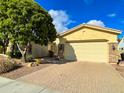 Single story home with neutral tones and a two car garage at 3840 E San Mateo Way, Chandler, AZ 85249