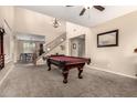 Spacious game room featuring a pool table, high ceilings, and an open floorplan at 4254 S Winter Ln, Gilbert, AZ 85297