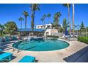Resort-style pool area with lounge chairs and a covered seating area for relaxing and enjoying the sunshine at 5124 N 31St Pl # 514, Phoenix, AZ 85016