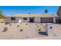 Charming single story home with desert landscaping, and a two car garage at 5525 E Waltann Ln, Scottsdale, AZ 85254