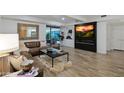 Cozy living room with a fireplace and mounted television, complemented by comfortable seating and contemporary design at 7137 E Rancho Vista Dr # 3007, Scottsdale, AZ 85251
