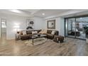 Inviting living room boasts a plush leather sofa, stylish decor, and expansive windows offering ample natural light at 7137 E Rancho Vista Dr # 3007, Scottsdale, AZ 85251