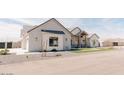 Single Gathering home with a two-car garage, desert landscaping, and modern architectural features at 1228 N 106Th Pl, Mesa, AZ 85207