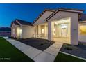 Inviting single-story home featuring stone accents and a covered porch at 1229 N 106Th Pl, Mesa, AZ 85207