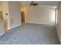 The inviting living room features high ceilings and neutral paint palette at 1264 W 6Th Ave, Apache Junction, AZ 85120