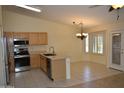 Bright kitchen featuring stainless steel appliances, an island sink, and an attached breakfast nook at 1320 E Bellerive Dr, Chandler, AZ 85249