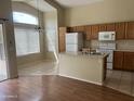 Bright kitchen with ample cabinet space, white appliances, and a functional island at 14228 N 150Th Ln, Surprise, AZ 85379