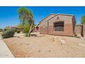 Charming single-story home with desert landscaping and neutral-toned stucco exterior at 18322 W Sweet Acacia Dr, Goodyear, AZ 85338