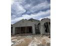 New construction home showing stucco application, framing, and tile roof installation at 1959 E Bucking Bronco Dr, San Tan Valley, AZ 85140