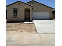 Charming single-story home featuring a two-car garage and a simple, Southwestern-style exterior at 1973 E Bucking Bronco Dr, San Tan Valley, AZ 85140