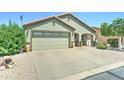 Lovely home featuring a two-car garage, low maintenance gravel yard, and covered entryway at 2101 S Meridian Rd # 250, Apache Junction, AZ 85120