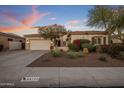 Charming single-Gathering home with a well-manicured front yard and a spacious two-car garage at 24121 N 24Th Pl, Phoenix, AZ 85024