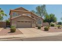 Attractive two-story home with a well-maintained front yard and a two-car garage at 321 W Betsy Ln, Gilbert, AZ 85233