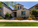 Inviting home exterior featuring a well-manicured lawn and vibrant flower beds at 4901 S Turbine --, Mesa, AZ 85212