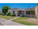 Lovely single-story home with well-kept landscaping and a covered front porch entry at 556 N Hobson Plz, Mesa, AZ 85203