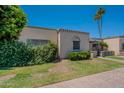 Charming single-story home with manicured lawn and a covered front porch at 556 N Hobson Plz, Mesa, AZ 85203