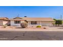 Inviting single-story home with a neatly maintained front yard and attached two-car garage at 5633 E Colby St, Mesa, AZ 85205