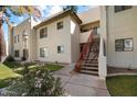 Exterior view of a two story condo with a red stairway at 750 E Northern Ave # 2143, Phoenix, AZ 85020