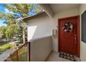 Front door entrance to a home with a wreath and welcome mat at 750 E Northern Ave # 2143, Phoenix, AZ 85020